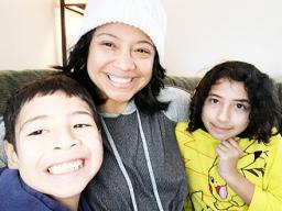 Epifania Rapozo (middle) and her two children