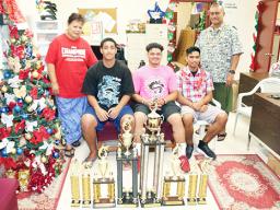 (L-R sitting) Best Defensive Player George Tuiolemotu (SHS), Coach of the Year from Faga’itua High School, and Season MVP Lisi Ianuari (FHS)