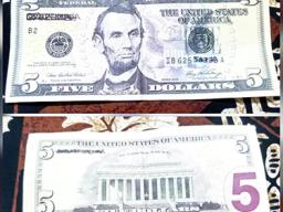 Photos of back and front of fake $5 bill.