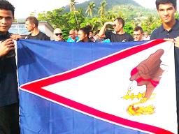 Two local fighters representing American Samoa during the 2018 Oceania Youth Boxing Championships, which was also a Qualifier Championship for the Youth Olympics Games in Argentina this year, Falaniko Tauta and Jolando Taalo, posing with the American Samoa flag.