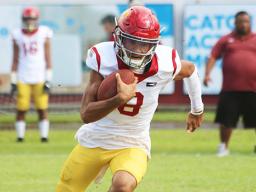Tafuna Warriors quarterback Oakland Salave’a scrambling