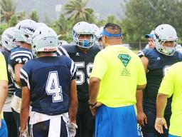 Samoana Sharks head coach, Pati Pati giving advice to his defensive unit 