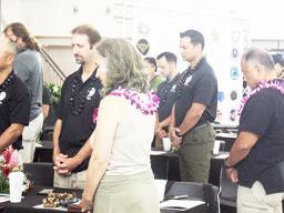 FEMA and Red Cross personnel during a moment of silence