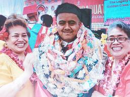 Toamalama Filiki Toelupe with others at FHS graduation