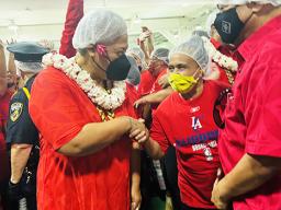 Samoa Prime Minister Fiame Naomi Mataafa shakes hands with a StarKist employee