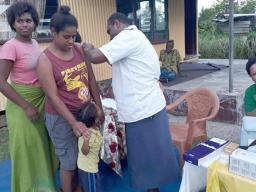 Woman receives a measles vaccination in Fiji