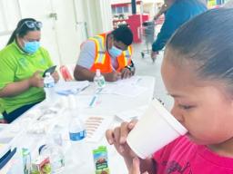 Little girl taking Lymphatic Filiariasis pills 