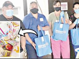 Volunteers packaging up food and supplies for stranded residents.