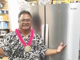 Talavave Maae with the Whirlpool refrigerator he won.