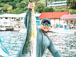 Man holding up a masi masi 