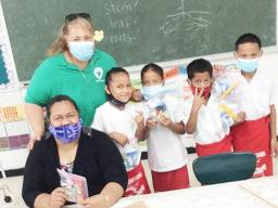First grade students at Fitiuta hold up gifts