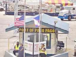 American Samoa and U.S. flags at half staff at Port.