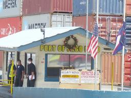 Flags lowered at entrance to port