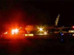 Aircraft on runway at HNL at night during emergency landing
