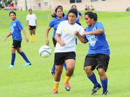 Jordynn Liu-Kuey of Fa’asao-Marist (left) in action against a Samoana defender during