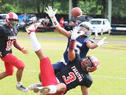 Samoana Sharks Allen Seagai (15) concentrates on trying to catch this long pass from Viliamu Tanielu,