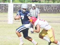 Viliamu Tanielu of the Sharks trying to evade a Tafuna defender