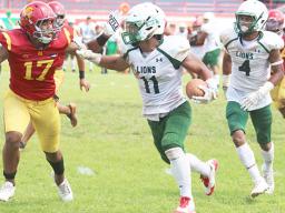 Pearson Livi of the Leone Lions focus on timing his stiff arm 