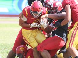 Faga’itua defenders trying to strip the ball out of Koison Ozu’s grip