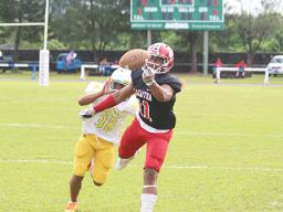 Manuita Sofeni (11) of the Vikings attempting to catch a long pass by