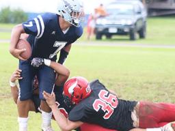Samoana Sharks quarterback Viliamu Tanielu is sacked 