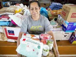 Fatima Sae with some of the donations