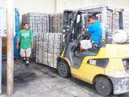 GHC Reid employees working with cans for recyling