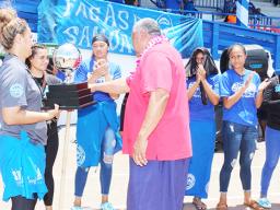 Gov pesents Volleyball trothy to Samoana girls coach