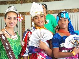 GLOW girls wearing their recycled outfits with 2018 Miss Samoa