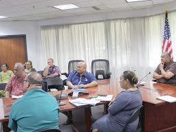 Governor with directors during virtual meeting with DOI