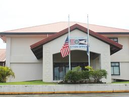 Flags at half staff in front of election office