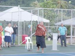 Governor Lemanu P.S. Mauga serves opening ball