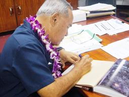 Governor signs new edition of Centennial Book 