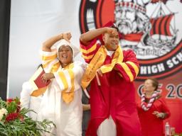 Two graduates celebrating