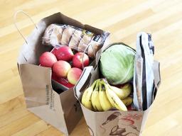Two grocery bags of food