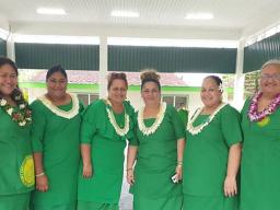 Teachers and principal pictured inside new gym