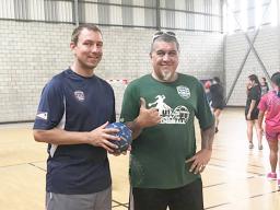 American Samoa Handball Association (ASHA) president and head coach Carl Floor Sr., and ASBA coach Michael Marsik with American Samoa’s U20 Women’s Handball Team practicing in the background