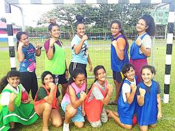 Youngsters with handball players after a handball fun program