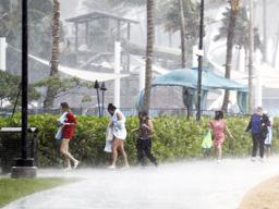 People running through the rain