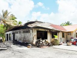 Partially burned home in Nuuuli
