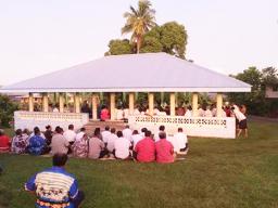 Members of the village of Falefa present a traditional Samoan ifoga 
