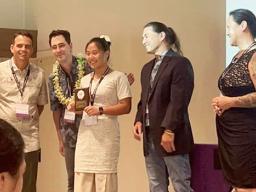 Amelie Chen and her parents at winners' ceremony