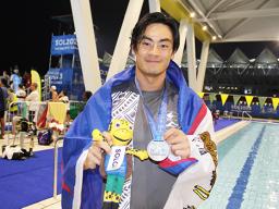 Micah with medal