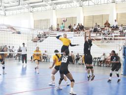 A West Coast player about to spike the ball 