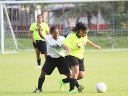 Juliana Radinikadavu (left) of Ilaoa & To’omata defends against Pago Youth’s Faafeu Amisone