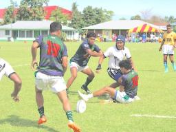 Barbarians and Bula Fiji players scramble for the ball 