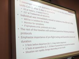 A large screen displayed information on the local resident who tested positive for COVID-19