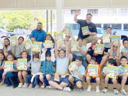 Manumalo Academy students thanks Rotary for dictionaries
