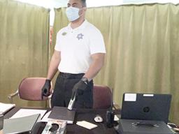 Jake Tagaloa with a mask and gloves protecting himself and others from the virus