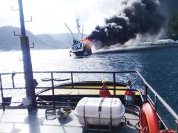 The crew of the tug Iseula tows to the 228-foot commercial fishing vessel Jeanette from the port of Pago Pago
